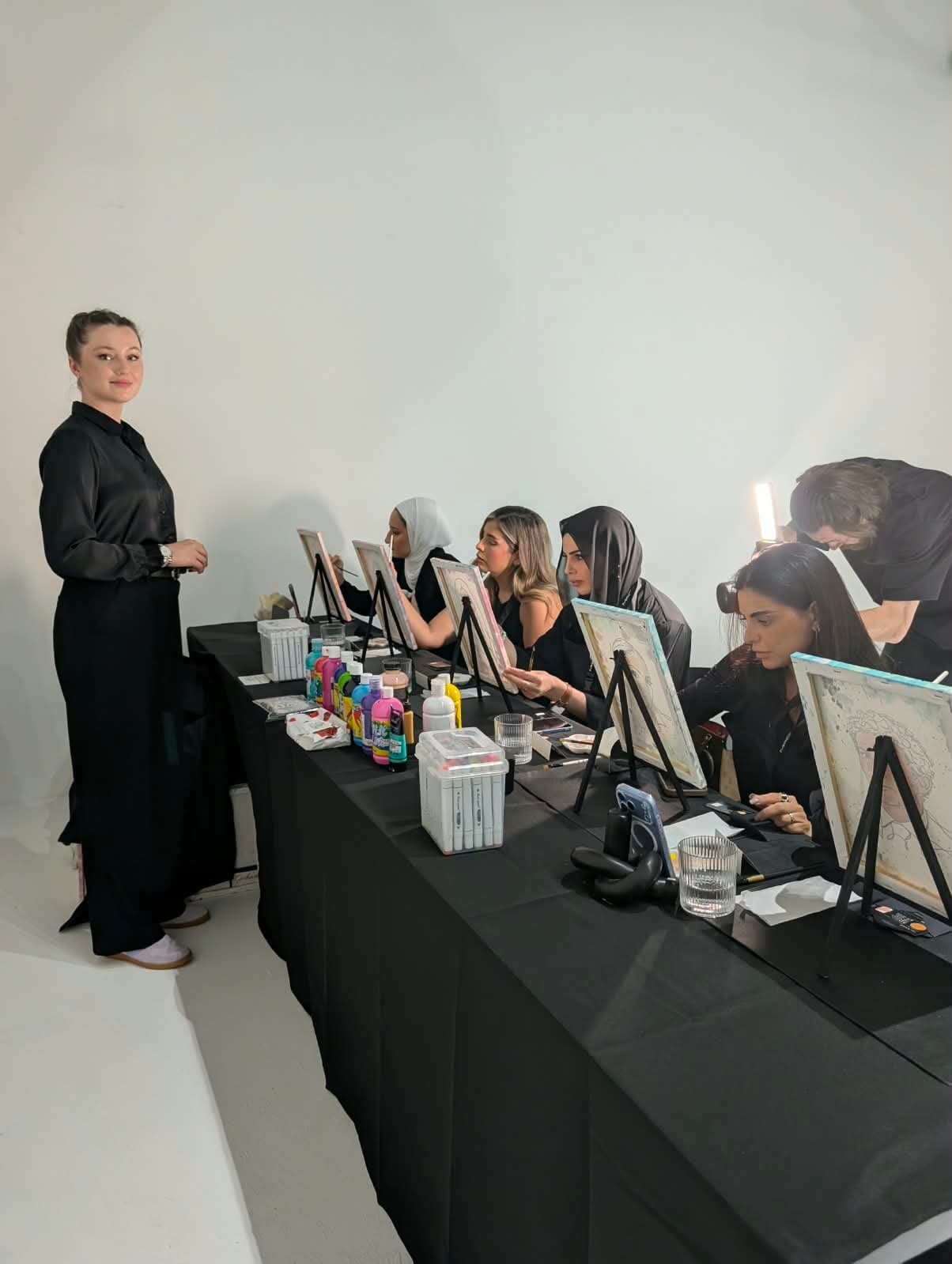 Inga Chalaia leading a portrait painting workshop for MAC Cosmetics guests in Dubai