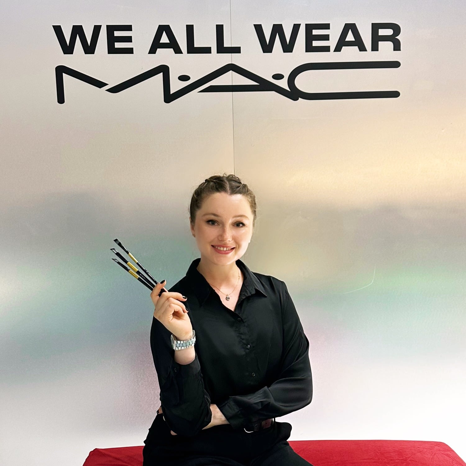 Inga Chalaia holding paintbrushes at the MAC Cosmetics painting workshop in Dubai